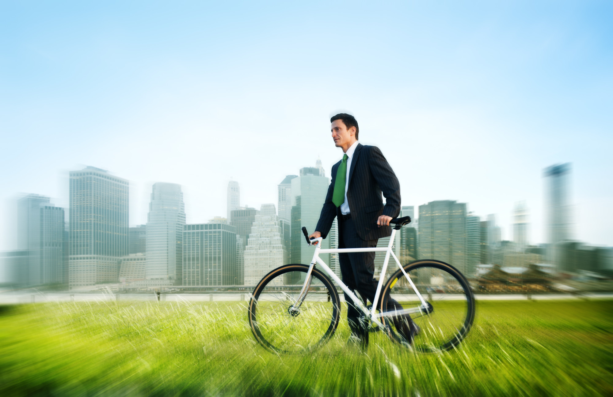 business man pushing bike