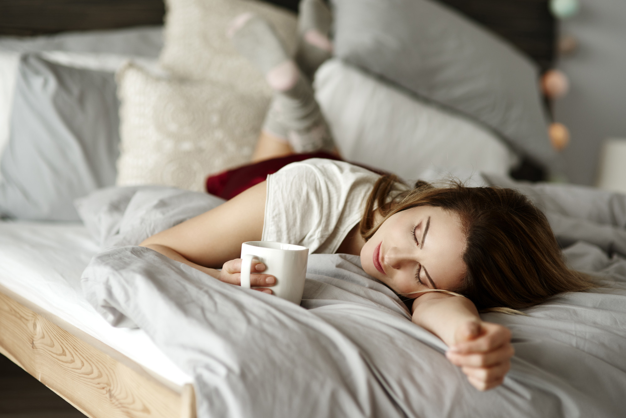 woman with tea in bed